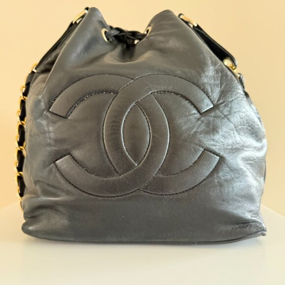 CHANEL | CC Logo Embossed Black Lambskin Drawstring Bucket Bag - Picture 2 of 8